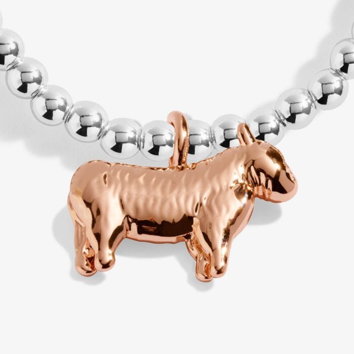 Rose gold dog-shaped charm