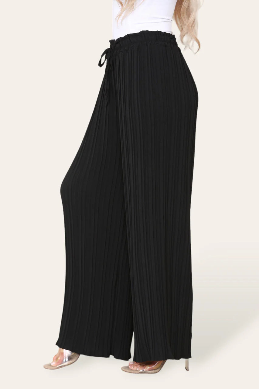Black pleated wide-leg pants worn by a person