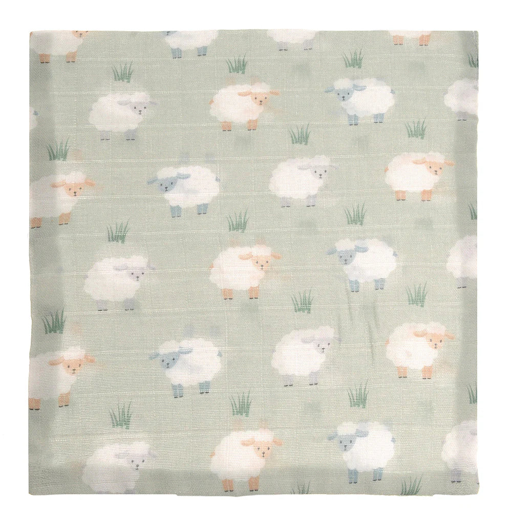 Flannel fabric with sheep pattern on a light green background