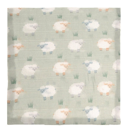 Flannel fabric with sheep pattern on a light green background