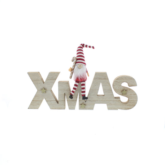 Gonk sitting on a Xmas Sign
